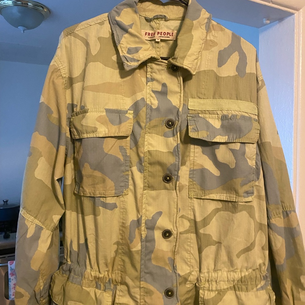 Gently used Free People camouflage light weight drawstring jacket.